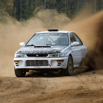 Driving behind the wheel of a Subaru Impreza on a gravel track (3 laps)